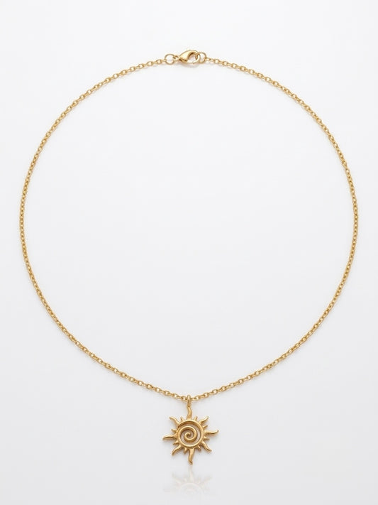 Gold spiral sun pendant necklace on a fine chain by Lumina Manor.