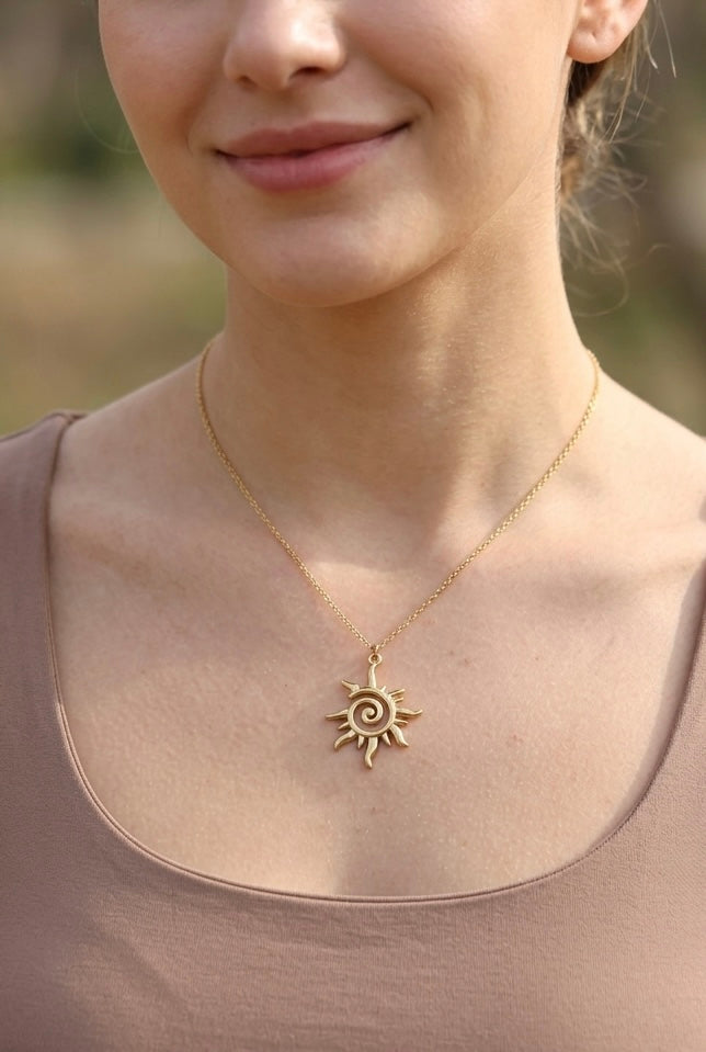 Model wearing the Lumina Manor Solstice Sun Pendant Necklace.