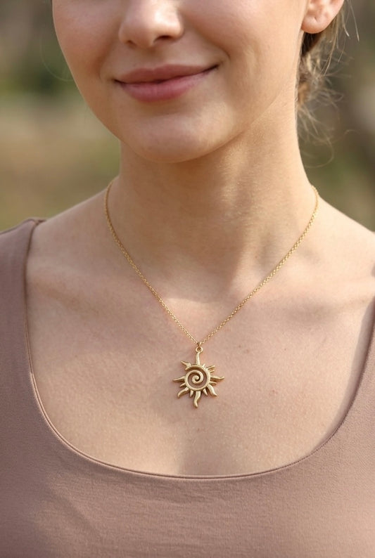 Model wearing the Lumina Manor Solstice Sun Pendant Necklace.