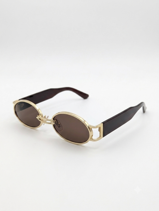 Lumina Manor Vintage Luxe sunglasses with gold metal frame and brown lenses angled view.