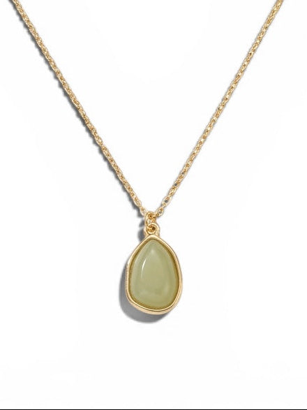 Gold-tone necklace featuring a sage green teardrop pendant on a delicate adjustable chain.