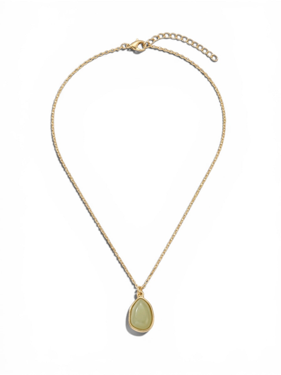 Gold-tone necklace featuring a sage green teardrop pendant on a delicate adjustable chain.